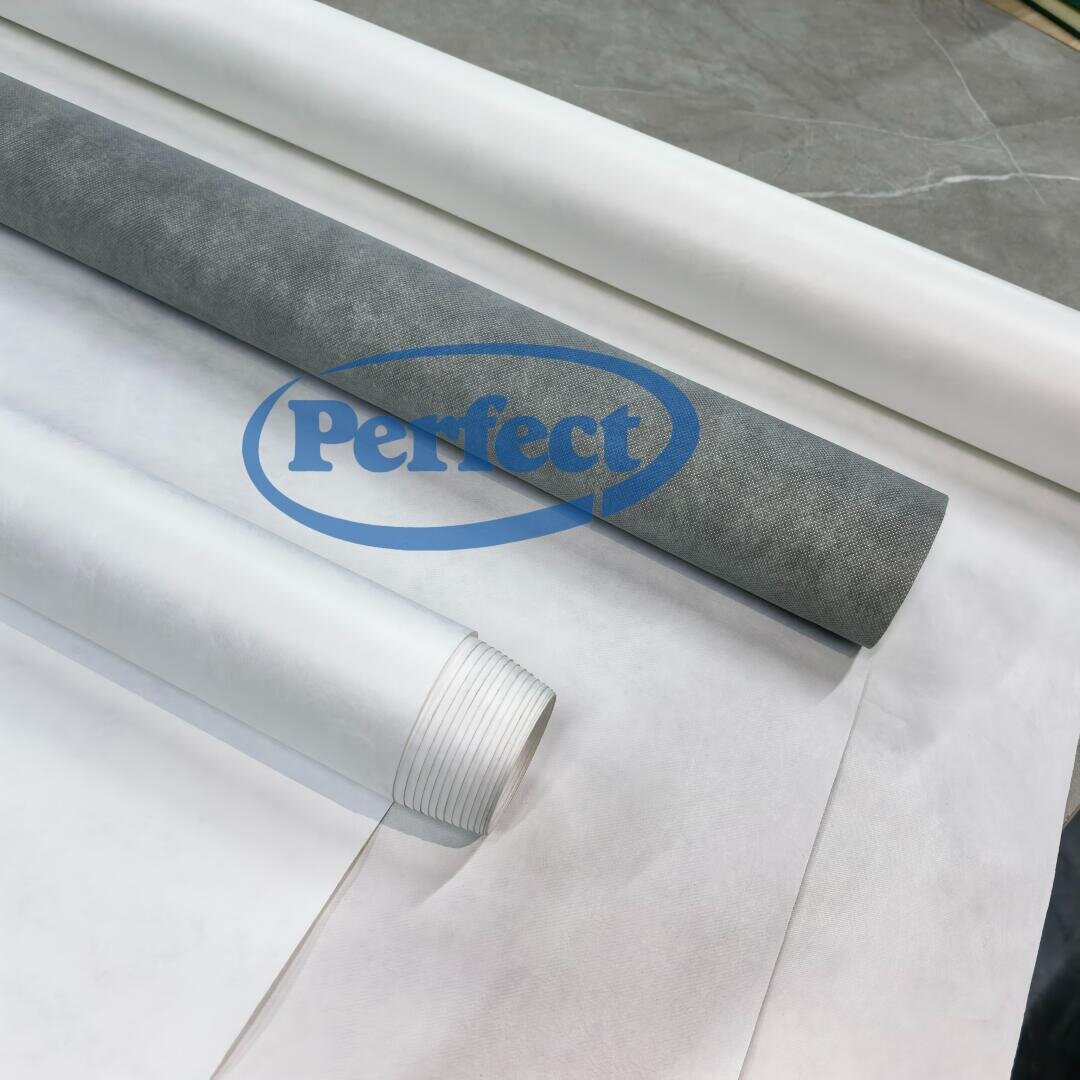 Several rolls of thin, white and gray textile-like material are unrolled and layered on a flat surface. The word Perfect in blue appears overlaid in the center of the image.