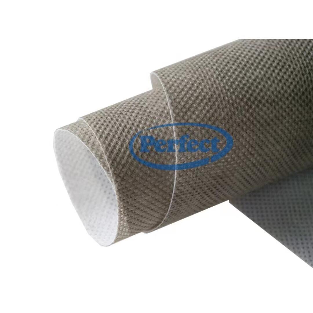 A close-up of two overlapping rolls of textured, grayish non-woven fabric with a visible grid pattern, shown against a white background. The word Perfect is faintly visible in blue on the image.