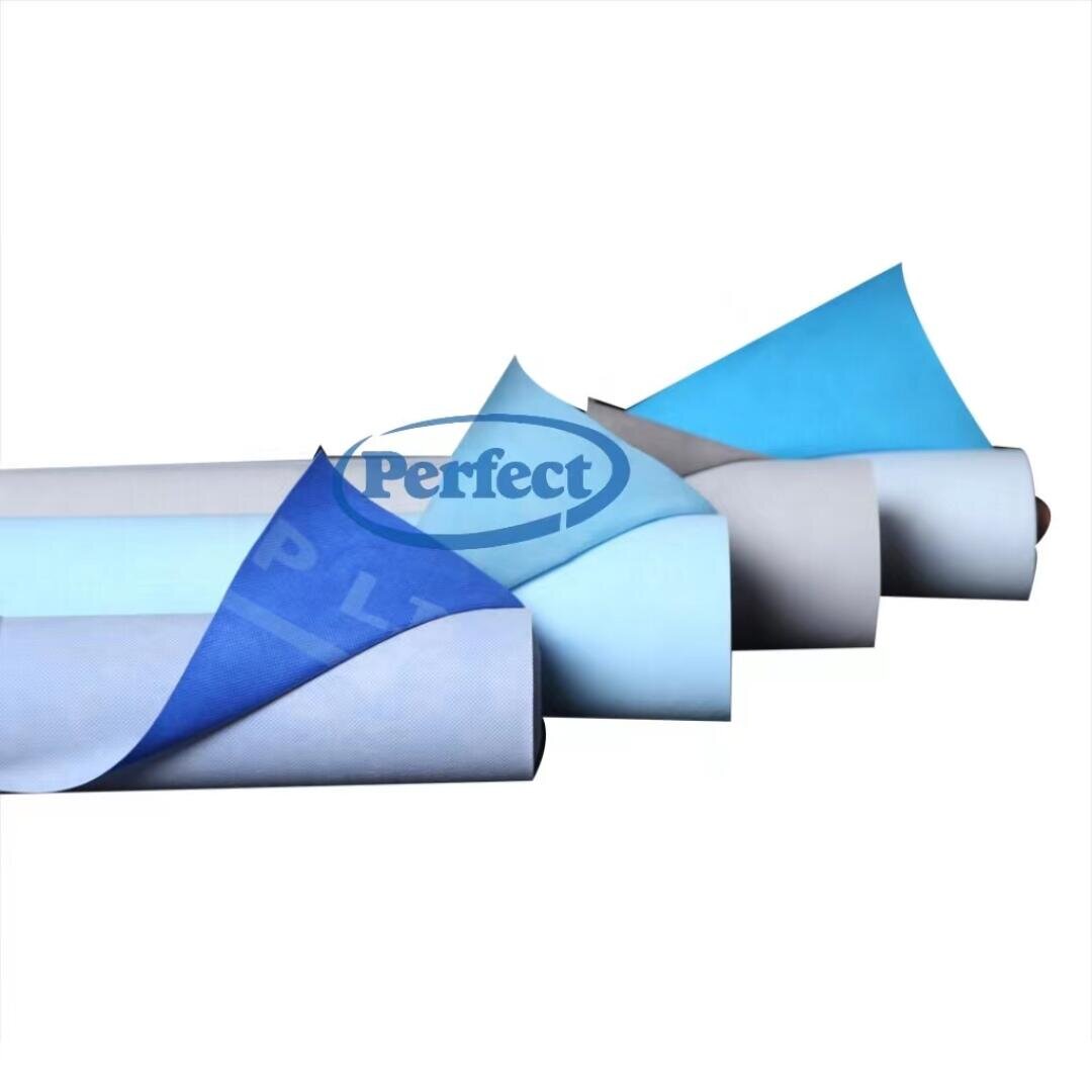 Three rolls of blue, light blue, and white fabric or paper, each partially unrolled and layered on top of each other, displayed on a white background with the word “Perfect” faintly visible.