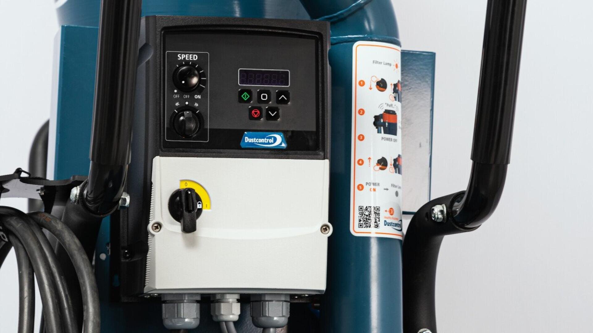 Close-up of a control panel on a piece of industrial equipment, showing buttons, a speed switch, indicator lights, a display screen, a dial switch, and a diagram with instructions on the right side.