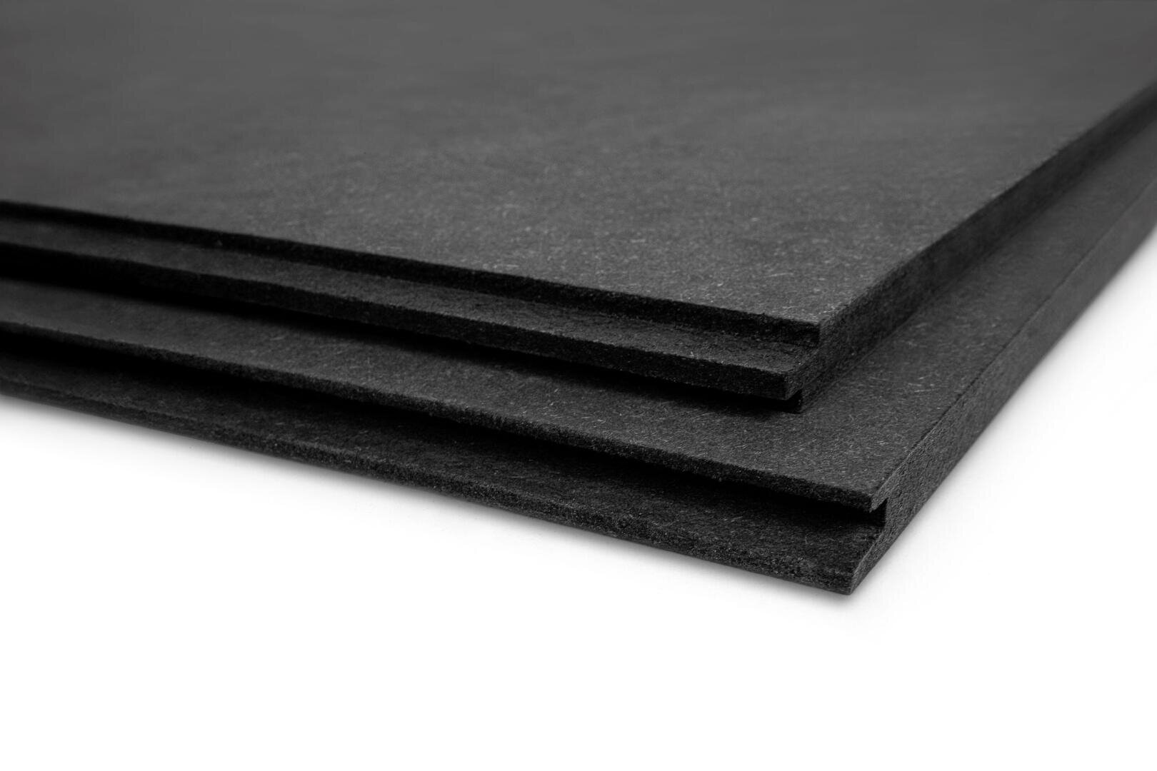 Three stacked black foam sheets with smooth surfaces, shown from a side angle against a white background.
