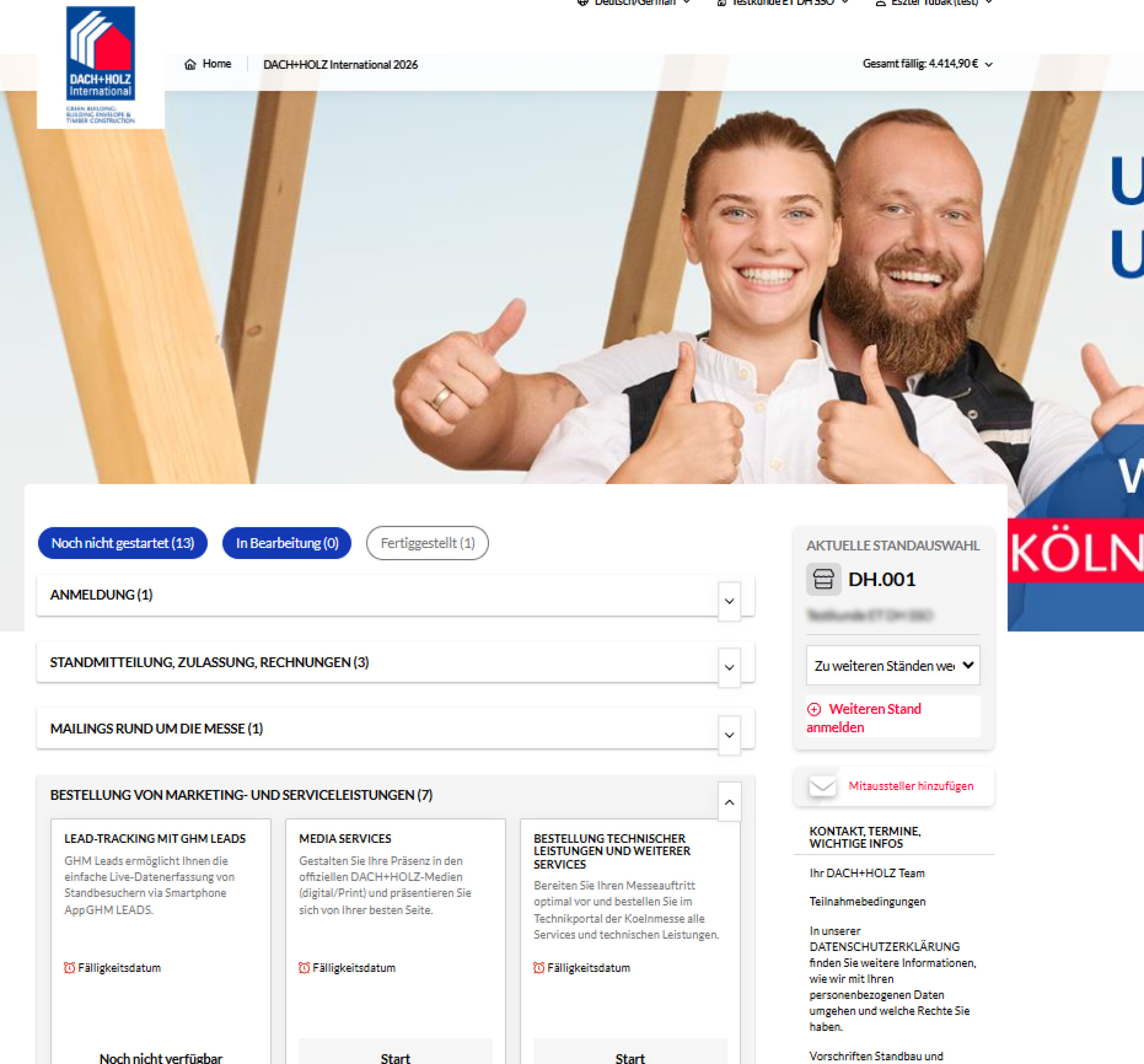 A smiling man and woman giving thumbs up stand in front of wooden beams. Text reads OUR FAIR. OUR STRENGTH. and We look forward to you! COLOGNE 24.–27.02.2026. Login form is on the left side.